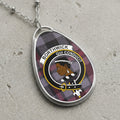Borthwick clan Scottish tartan necklace with clan crest and Qui Conducit motto on tartan background