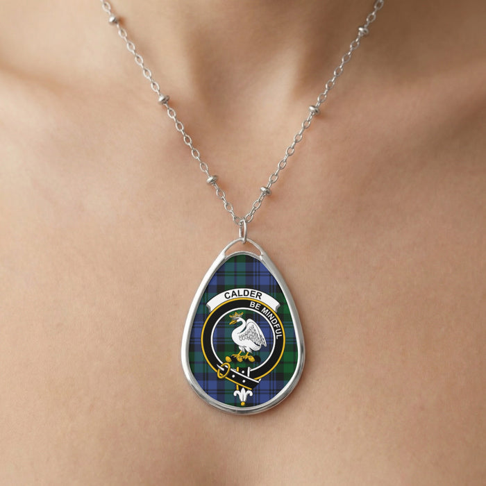 Close-up of Calder clan tartan pendant necklace with crest and Be Mindful motto