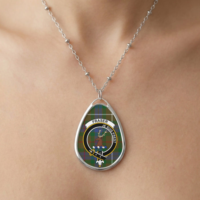 Close-up of Fraser clan tartan pendant necklace with crest design