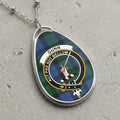 Gunn clan Scottish tartan necklace with clan crest and Aut Pax Aut Bellum motto on tartan background