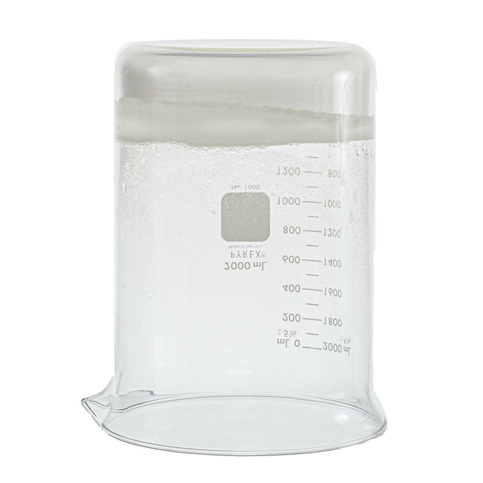 upside-down 2000 milliliter glass beaker. Beaker contains the sodium polyacrylate product after water was poured into it. The product is sticking to the bottom of beaker. Picture is used to display consistency of product after water contact.